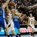 Manchester sophomore Maddie Collins grabs a rebound in the game against Saginaw Nouvel on Saturday, March 16. Daniel Brenner I AnnArbor.com